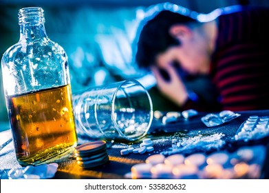 Depressed young woman tries to commit suicide by medicine and alcohol overdose