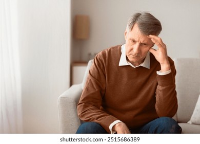 Depression After Retirement. Sad Elderly Man Thinking About Loneliness Sitting On Couch At Home. Selective Focus, Copy Space - Powered by Shutterstock