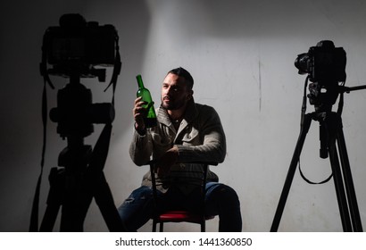 Depression And Alcoholism. Alcohol Addict Drinking Wine In Photo Studio. Hispanic Man Suffering From Alcohol Abuse. Depressed Latino Man Drinking Alcohol. Treating Chronic Alcohol Addiction.