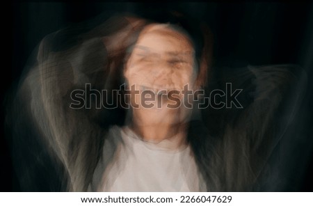 Depression, bipolar and blur face of woman in studio on black background for mental health problems. Psychology, schizophrenia and depressed girl with anxiety, confusion and suffering identity crisis