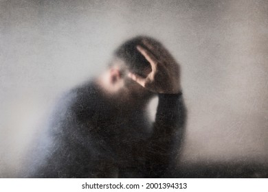 Depression. Broken man behind a dusty scratched glass. - Shutterstock ID 2001394313
