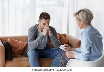 Depression Counseling. Desperate Man Telling About Unhappy Life While Professional Psychologist Taking Notes During Appointment In Office. Selective Focus - Shutterstock ID 1727099176