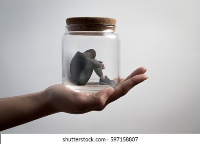the depression man sit imprisoned in jar