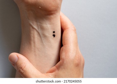 Depression and mental health concept - semicolon tattoo on wrist,  - Shutterstock ID 2170245055
