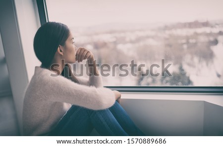 Depression, mental health, psychology therapy - mind wellness well being Asian girl with winter blues seasonal affective disorder feeling sad or heart broken with breakup alone. Loneliness, burnout