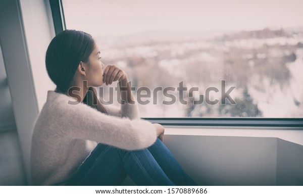 Depression, mental health, psychology therapy -\
mind wellness well being Asian girl with winter blues seasonal\
affective disorder feeling sad or heart broken with breakup alone.\
Loneliness, burnout