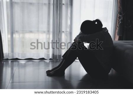 Depression person of a young woman is unhappy. Loneliness man sitting alone. Woman disappointment and hopeless. despair, headache as crying. Man is upset, frustration, tired and negative feeling.