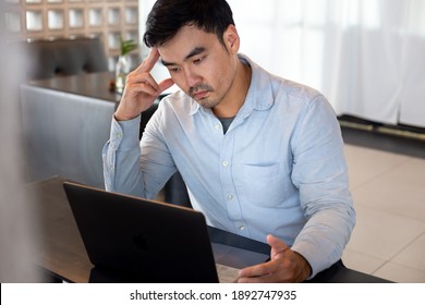  Depression Serious People From Work,study Stress Concept.asian Man Feeling Tired Suffering Using Computer Working Work Place.concept Global Economic,health Problems
