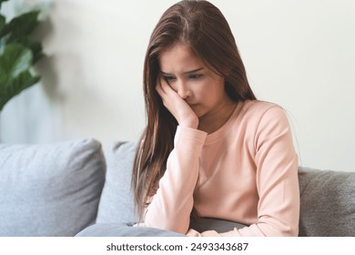 Depression in teenage concept, Young women covering her face feeling anxious and unhappy lock themselves at home sad emotional alone, and have mental disorders. - Powered by Shutterstock