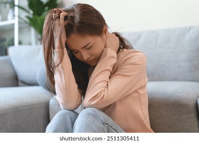 Depression in teenage concept, Young women covering her face feeling anxious and unhappy lock themselves at home sad emotional alone, and have mental disorders. - Powered by Shutterstock