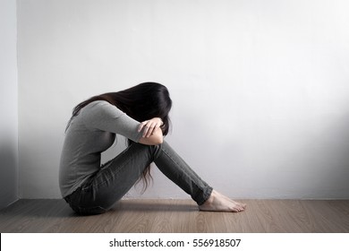 The depression woman sit on the floor