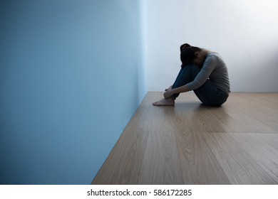 The depression woman sit on the floor