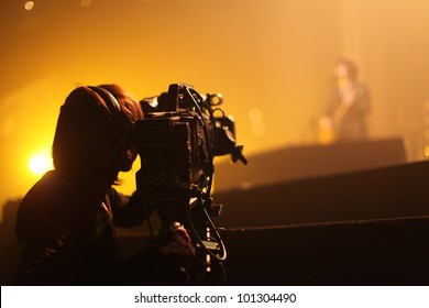 Depth of field image of an unidentified cameraman at an unknown concert in Tokyo, Japan