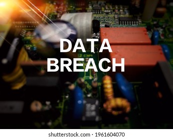 Depth of fill and bokeh effect for electronic circuit board, with flare and wording DATA BREACH on top of circuit. Security, data, technology and privacy concept.