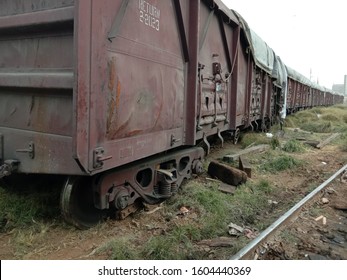 Derailed train Wagons covered with tarpaulin at a railway track due to broken line