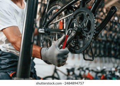 The derailleur issue, fixing. Close up view of man's hands that is repairing bicycle. - Powered by Shutterstock