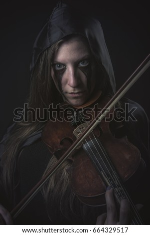 Deranged female ghost violin player, halloween concept