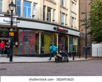 Derby UK, October 4 2020: A Food Delivery Courier Enters A Resturant To Collect Food For Delivery.