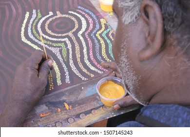 DERBY, WA - SEP 10 2019:Aboriginal Artist Dot Painting.Before Indigenous Australian Art Was Ever Put Onto Canvas The Aboriginal People Would Smooth Over The Soil To Draw Sacred Ceremony Designs.