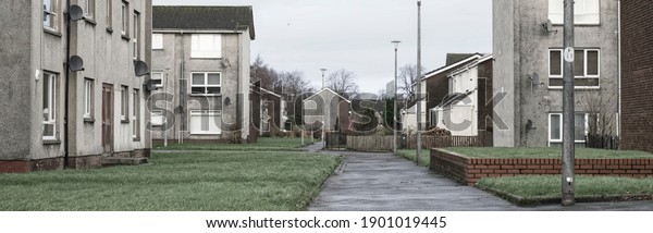 Derelict council house in poor\
housing estate slum with many social welfare issues in Port\
Glasgow