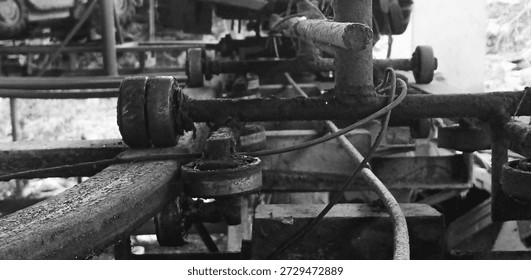 Derelict rollers and tracks within an aging workshop