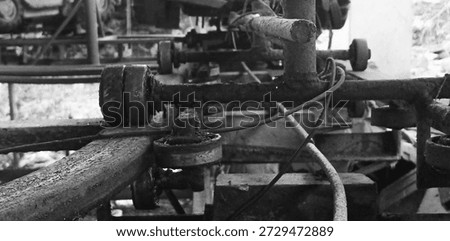 Derelict rollers and tracks within an aging workshop