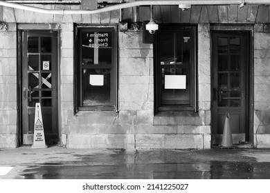 Derelict Stone Building With Decades Of Neglect, Decay, And Inner City Decline In Black And White.