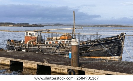 Similar – Image, Stock Photo Fishing boat moored in ocean water