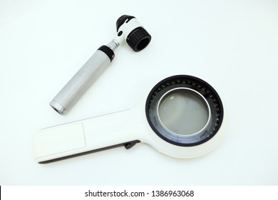 dermatological instruments for examination of moles, birthmarks-Dermatoscope and electronic magnifying glass close-up on a white background. Prevention of melanoma