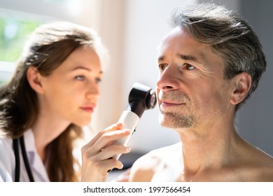 Dermatologist Checking Skin Allergy And Pigment Problems - Powered by Shutterstock