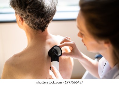 Dermatologist Checking Skin Allergy And Pigment Problems - Powered by Shutterstock