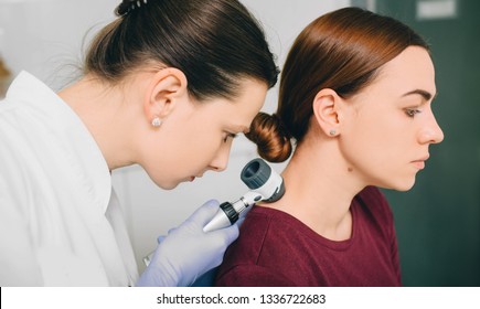 Dermatologist Exam Skin Mole On Female Neck Using Dermatoscope