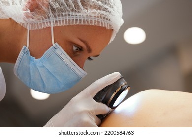 A dermatologist examines the skin. High quality photo - Powered by Shutterstock