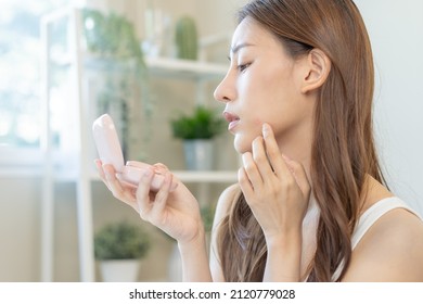 Dermatology, Puberty Asian Young Woman, Girl Looking Into Mirror, Allergy When Wear Mask And Cosmetic, Show Squeezing Pimple Spot For Removing From Face.Beauty Care From Skin Problem By Acne Treatment