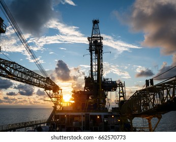 Derrick of Tender Assisted Drilling Oil Rig (Barge Oil Rig) on The Production Platform During Sunrise
