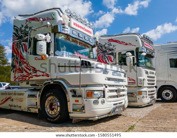 Derventa\
/ Bosnia and Herzegovina - August 4, 2019: Scania semi trucks \
parked in the parking lot. Swedish automotive industry manufacturer\
of specifically heavy trucks and buses. -\
Image
