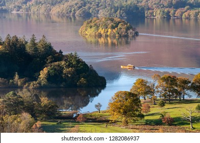 Derwent Water Lake In The Lake District Cumbria In Autumn Colours And Boat.