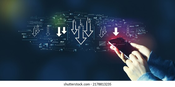Descending arrows with person using a smartphone - Shutterstock ID 2178813235