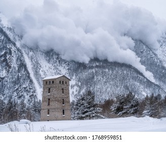 Descent of an avalanche from the mountain. House at the foot of the mountain. Winter mountain landscape. - Shutterstock ID 1768959851