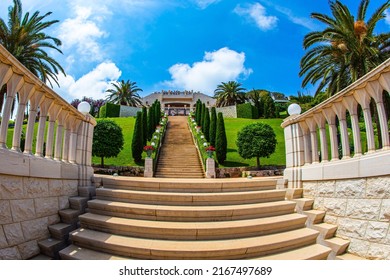 The descent to the Mediterranean Sea. Magnificent marble staircase and garden terraces around the Mount Carmel Temple in Haifa, Israel. Bahai World Center. Clear sunny day by the sea