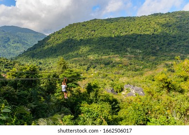 Descent To Zipline Through Mountains, Tropical Forest In Yanoda Park,  Sanya City. Hainan Island, China.