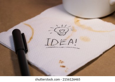 Describing Big Idea On A Coffee Stained Paper Napkin 