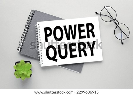 Description of Power Query on the page. on a gray background. two notebooks
