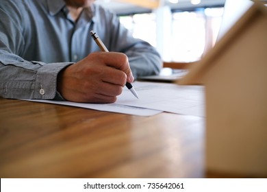 
* Description/Title/Caption: 
Business Man Signing Contract Making A Deal With Real Estate Agent Concept For Consultant And Home Insurance Concept