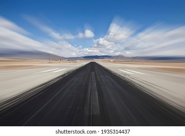 Desert Airport Runway With Dark Skid Marks And Motion Blur.