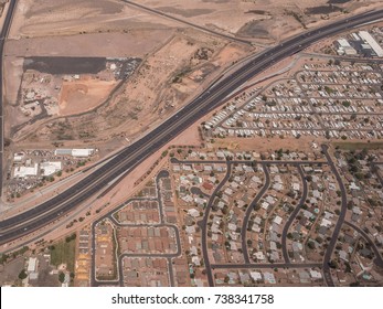 Desert becomes city dissected by a highway in Phoenix, Arizona.