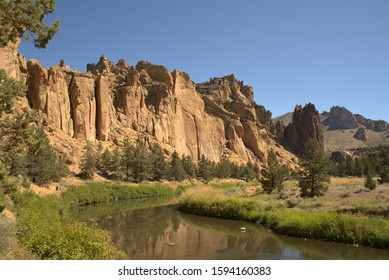 Desert Canyon With Winding River In Oregon