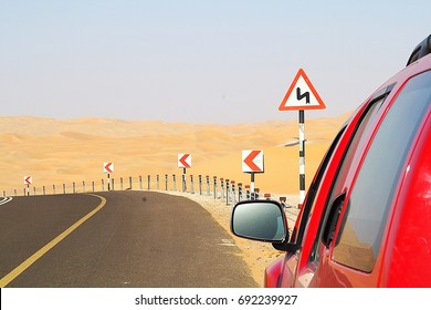 Desert Drive ,road Sign Liwa Dunes Abu Dhabi,red Car