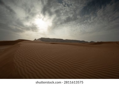 Desert Dunes Under Dramatic Cloudy Sky