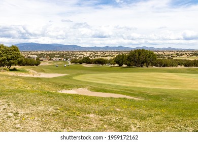 A Desert Golf Course In Santa Fe, New Mexico On A Cloudy Day